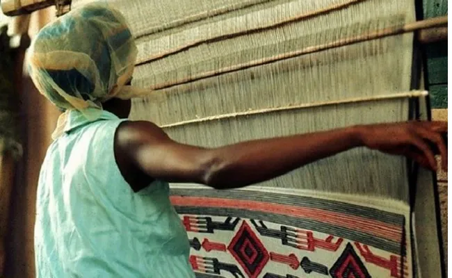 Akwete weaver by Lisa Aronson.